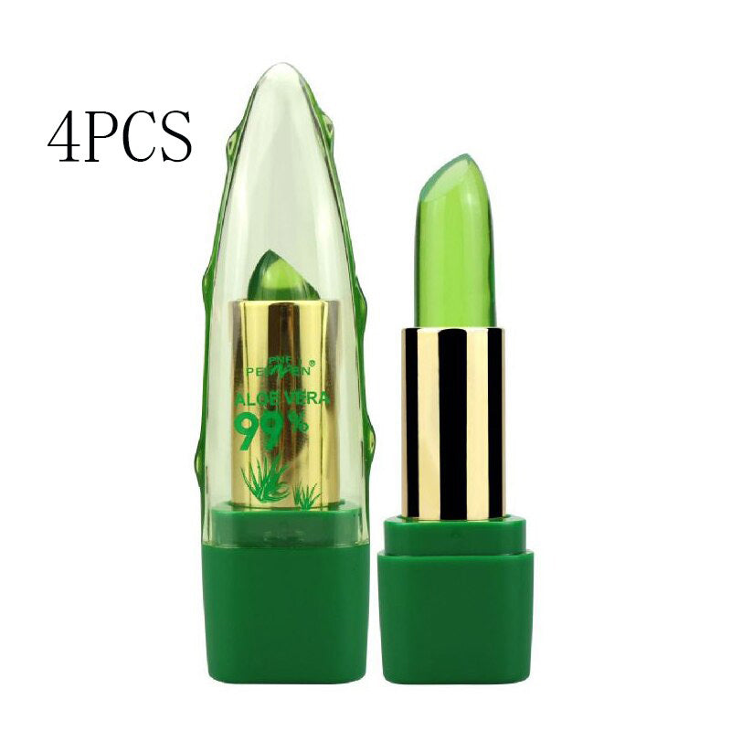 Green aloe vera lip balm with gold cap on a white background