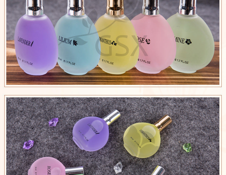 Set of colorful perfume bottles with visible brand names on a wooden shelf.