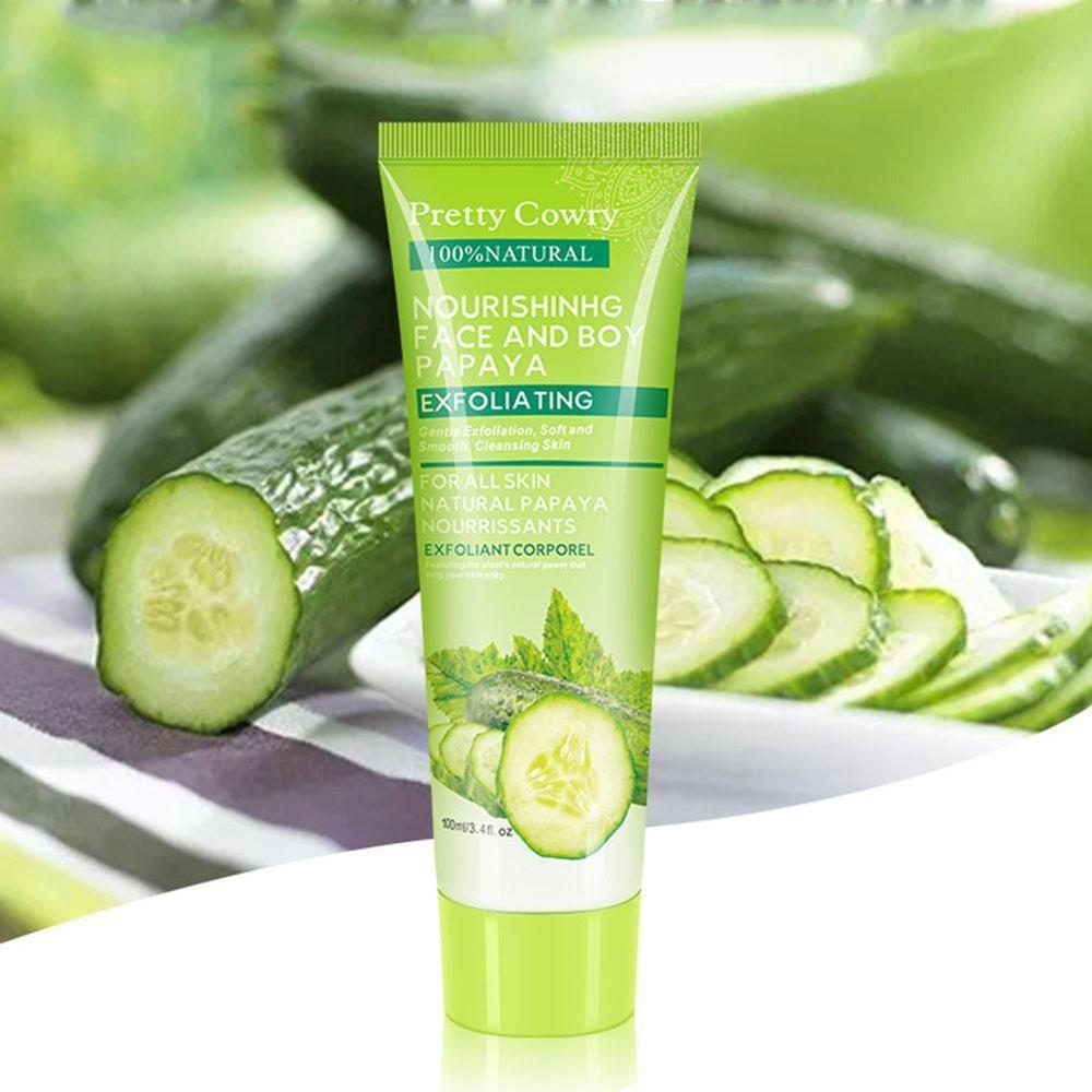 Tube of 'Pretty Cowry' exfoliating cream with cucumbers and papaya slices in the background