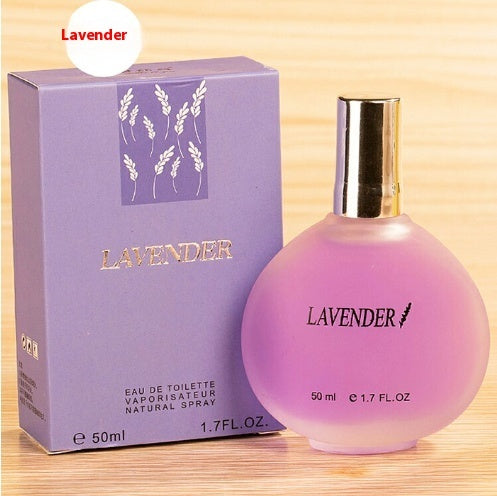Lavender perfume bottle and packaging on a wooden surface
