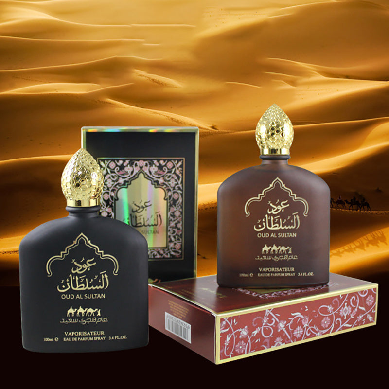 Two Oud Al Sultan perfume bottles with their packaging against a desert background