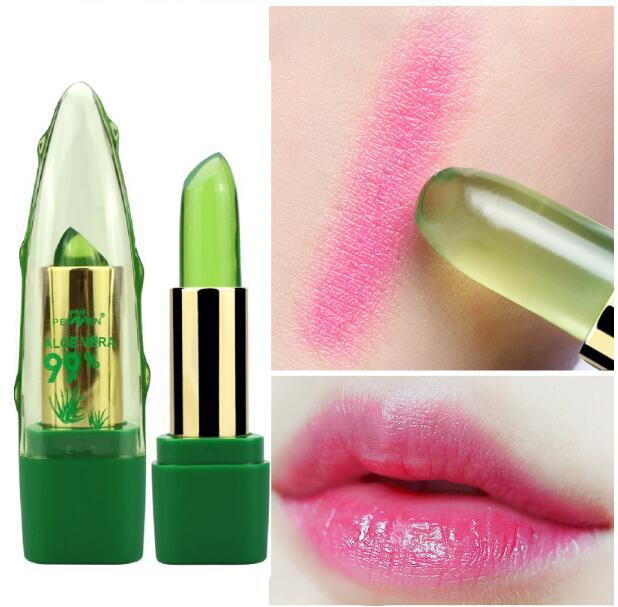 Green lipstick with gold accents, swatch on skin, and close-up of lips wearing the lipstick.