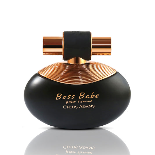 Black and gold perfume bottle labeled 'Boss Babe pour femme' by Chris Adams on a white background