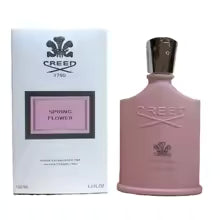 Pink Creed perfume bottle with packaging on a white background