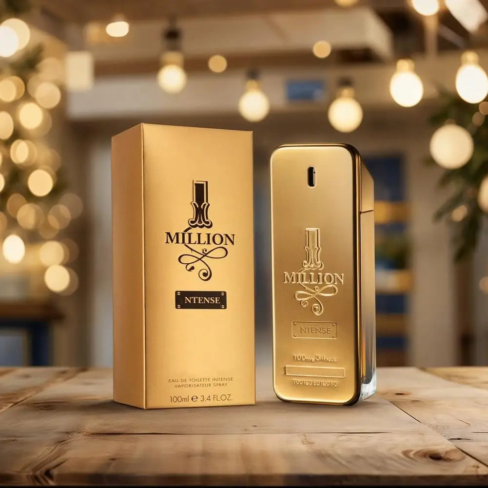 Gold '1 Million' perfume bottle and packaging on a wooden surface with blurred lights in the background