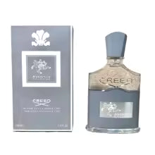 Creed perfume bottle and packaging on a white background