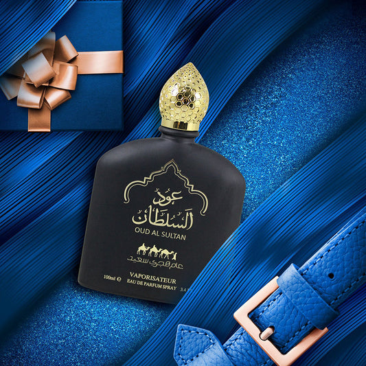Oud Al Sultan perfume bottle with gold cap on a blue textured background