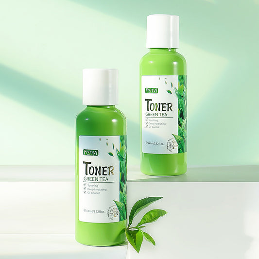 Two bottles of Feny Green Tea Toner on a light green background