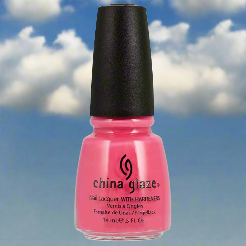 Pink nail polish bottle with black cap against a blue sky background